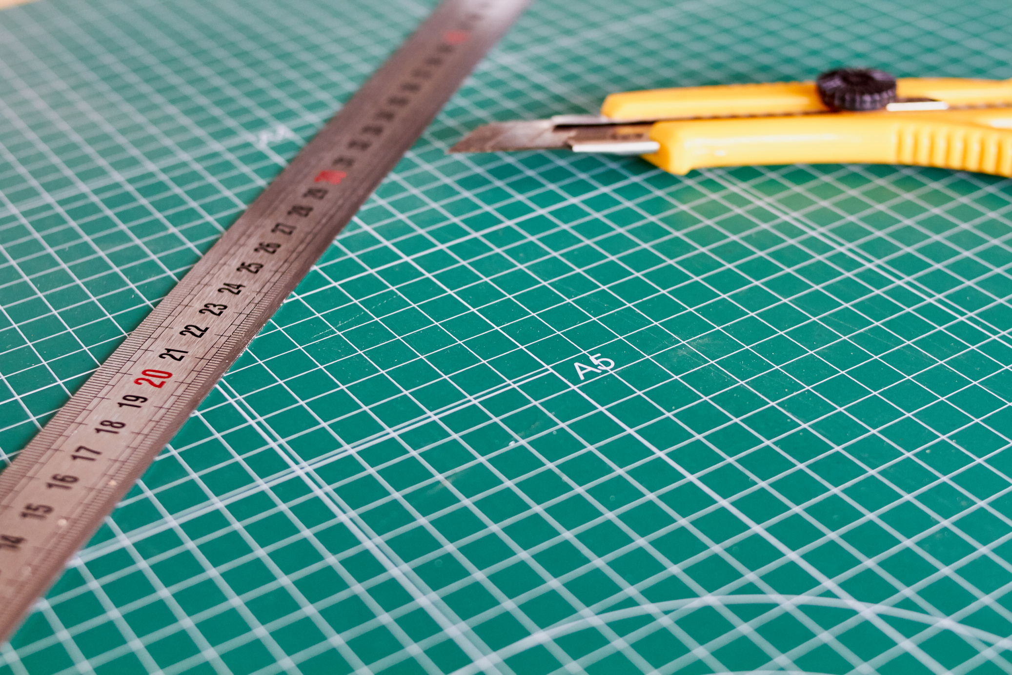 Cutter and Ruller and Green Cutting Mat